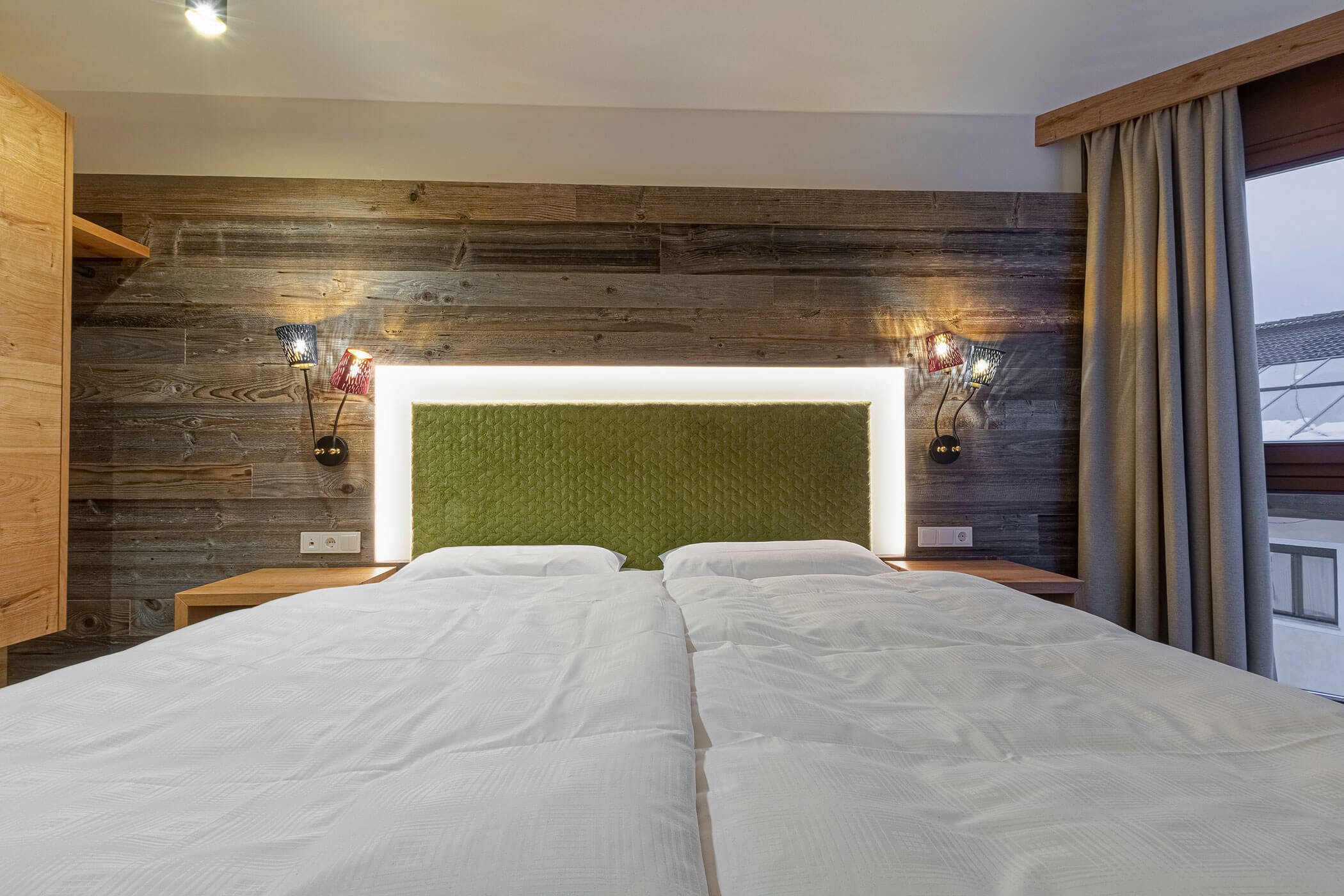 Doppelbett in der Ferienwohnung Colalto - Posta Zirm